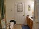 Bathroom with shower, tub and tiled floor. Vanity and decor along with a towel rack are present at 8103 Satillo Ln, Raleigh, NC 27616