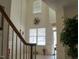 Bright foyer with high ceilings and a view of the staircase at 8103 Satillo Ln, Raleigh, NC 27616