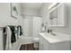Bathroom featuring a tub-shower combo, and a white sink and vanity with a mirror at 847 Estes St, Durham, NC 27701