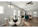 Cozy dining area with a glass table and chairs, opening into the living room at 847 Estes St, Durham, NC 27701