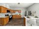 Functional kitchen with wooden cabinets, stainless steel appliances, and a breakfast bar with seating at 847 Estes St, Durham, NC 27701