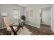 Office with a faux cowhide rug, a writing desk, and a neutral color palette at 847 Estes St, Durham, NC 27701