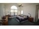 Bright bedroom with ceiling fan, large window, and a door to the exterior at 100 Sandy Hook Way, Cary, NC 27513