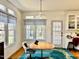 Cozy breakfast nook with a table, chair, natural light, and built-in cabinets at 100 Sandy Hook Way, Cary, NC 27513