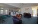 Open living room featuring vaulted ceilings, colorful furniture, and views into the kitchen at 100 Sandy Hook Way, Cary, NC 27513