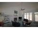 Bright living room with fireplace, ceiling fan, vaulted ceilings and large windows with lots of natural light at 100 Sandy Hook Way, Cary, NC 27513