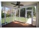 Relax on this screened in porch with ceiling fan and enjoy the private backyard views at 100 Sandy Hook Way, Cary, NC 27513