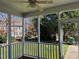 Relaxing screened porch with ceiling fan and backyard views, perfect for enjoying the outdoors in comfort at 100 Sandy Hook Way, Cary, NC 27513