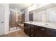 This bathroom features a double sink vanity and glass enclosed shower with seating at 1008 Scotch Pine Way, Mebane, NC 27302