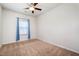 Cozy bedroom with a ceiling fan, neutral carpet, and a window with blinds and curtains at 1008 Scotch Pine Way, Mebane, NC 27302