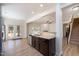 Open concept kitchen features stainless steel appliances and view to the living room at 1008 Scotch Pine Way, Mebane, NC 27302
