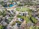 Aerial view of the neighborhood featuring mature trees, lush landscaping, and a beautiful green space at 102 Shepton Dr, Cary, NC 27519