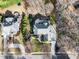 Aerial view of the custom home showcasing its beautiful architecture, mature trees, and landscaping at 102 Shepton Dr, Cary, NC 27519