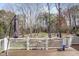 Spacious back deck with white railing overlooking the wooded backyard at 102 Shepton Dr, Cary, NC 27519