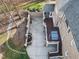 Aerial view of a backyard featuring a deck, patio, and water feature at 102 Shepton Dr, Cary, NC 27519