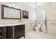 Cozy bathroom with vanity, cabinet storage, and shower-tub combo at 102 Shepton Dr, Cary, NC 27519
