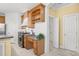 Kitchen area with stainless steel appliances and custom cabinetry at 102 Shepton Dr, Cary, NC 27519