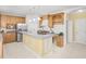 Well-equipped kitchen with stainless steel appliances, custom cabinets and island at 102 Shepton Dr, Cary, NC 27519