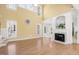 Spacious living room featuring a fireplace, large windows, and vaulted ceilings at 102 Shepton Dr, Cary, NC 27519