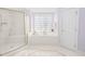 Luxurious main bathroom with a soaking tub and glass-enclosed shower at 102 Shepton Dr, Cary, NC 27519