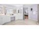 Bright, spacious bathroom featuring dual vanities and access to bedroom at 102 Shepton Dr, Cary, NC 27519