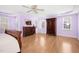 Spacious main bedroom featuring hardwood floors, tray ceiling, and modern dresser at 102 Shepton Dr, Cary, NC 27519