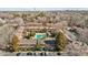 Aerial view showcases community pool, mature trees, and convenient parking, set against the city skyline at 105 Fidelity St # B24, Carrboro, NC 27510
