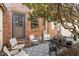 Charming back patio with comfortable seating, ideal for relaxation and outdoor enjoyment with brick accents at 105 Fidelity St # B24, Carrboro, NC 27510