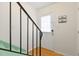 Hallway with stairs and an entry door with a window covering at 105 Fidelity St # B24, Carrboro, NC 27510