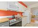 Well-lit kitchen boasts modern stainless steel appliances and butcher block countertops, with a colorful design at 105 Fidelity St # B24, Carrboro, NC 27510