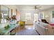 Bright living room with dining area, ceiling fan, hardwood floors, neutral paint and lots of natural light at 105 Fidelity St # B24, Carrboro, NC 27510