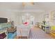 Cozy living room with hardwood floors, neutral walls, an oriental rug, with a view into the kitchen at 105 Fidelity St # B24, Carrboro, NC 27510