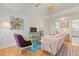 Inviting living room with hardwood floors, neutral walls, an oriental rug, with a view into the kitchen at 105 Fidelity St # B24, Carrboro, NC 27510
