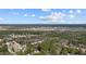 Expansive aerial view showcasing a community surrounded by lush forests and green landscapes at 1109 Sorcerer Ct Ct, Knightdale, NC 27545