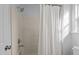 Bright bathroom featuring a white shower and a shower curtain for privacy at 1109 Sorcerer Ct Ct, Knightdale, NC 27545