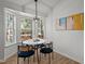 Bright dining area features a bay window and modern light fixture at 1109 Sorcerer Ct Ct, Knightdale, NC 27545