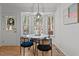 Bright dining area featuring a bay window and door to the back, with four chairs at 1109 Sorcerer Ct Ct, Knightdale, NC 27545
