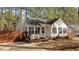 Charming single-story home featuring green shutters and a welcoming yellow wreath on the front door at 1109 Sorcerer Ct Ct, Knightdale, NC 27545
