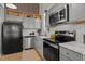 Updated kitchen featuring stainless steel appliances, and white subway tile backsplash at 1109 Sorcerer Ct Ct, Knightdale, NC 27545