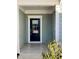 Inviting front porch with tiled floor and craftsman style door at 111 Kalmia Dr, Durham, NC 27703