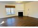 Spacious living room with fireplace and hardwood floors offers a cozy gathering space at 111 Kalmia Dr, Durham, NC 27703