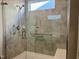 Modern bathroom shower stall with beautiful tile, grab bar and integrated bench seating at 111 Kalmia Dr, Durham, NC 27703