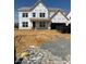 New construction featuring a spacious layout, two car garage, and covered porch, still under construction at 1124 Opal Ln # 88, Durham, NC 27705
