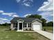 Charming single-story home with vinyl siding, black shutters, and a well-manicured front yard at 114 Johnson Ridge Way, Four Oaks, NC 27524