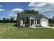 Charming single-story home with vinyl siding, black shutters, and a well-manicured front yard at 114 Johnson Ridge Way, Four Oaks, NC 27524