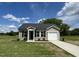 Charming single-story home with vinyl siding, black shutters, and a well-manicured front yard at 114 Johnson Ridge Way, Four Oaks, NC 27524