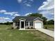 Charming single-story home with vinyl siding, black shutters, and a well-manicured front yard at 114 Johnson Ridge Way, Four Oaks, NC 27524
