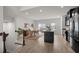 Open concept living space featuring a breakfast bar, dining area, and modern kitchen at 114 Journey Pl, Durham, NC 27703