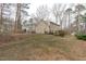 View of the large backyard and two story home at 115 Perth Pl, Durham, NC 27712