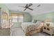 Bedroom with green walls, a ceiling fan, and natural light at 115 Perth Pl, Durham, NC 27712